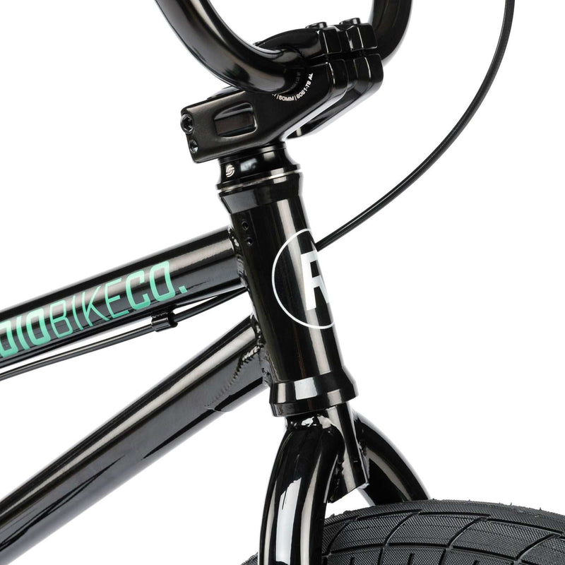 Close-up of the black RADIO SAIKO 20 complete bike frame and front fork showing the logo and front wheel tire.