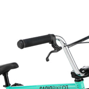 Close-up of RADIO SAIKO 20 complete bike handlebars and brake lever in teal color