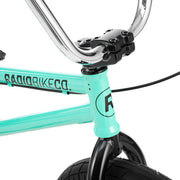 Close-up of RADIO SAIKO 20 BMX bike front frame and handlebars in teal with black fork and detailed components