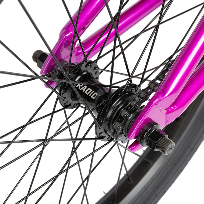 Close-up of the rear hub and metallic purple frame of the RADIO SAIKO 20 BMX bike wheel assembly.