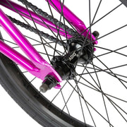 Close-up of the rear wheel and black RADIO hub on the metallic purple RADIO SAIKO 20 complete BMX bike.