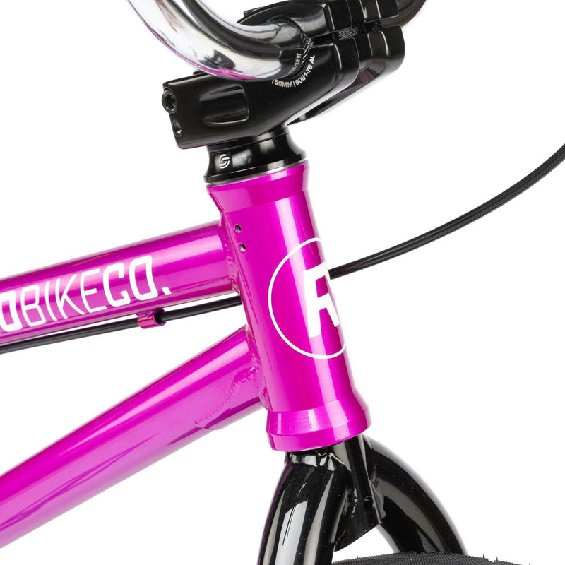 Close-up of the metallic purple Radio Saiko 20 complete bike frame and front fork with handlebar stem and brake cable