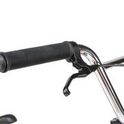Close-up of RADIO SAIKO 20 bike black handlebar grip and brake lever on chrome handlebar