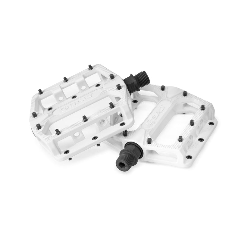 White alloy Salt Slim Pedals with replaceable pins and lightweight design.