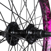 SALT EX cassette rear wheel with black hub, purple splatter Valon rim, and nylon hubguard.