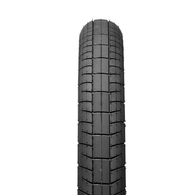 SALTPLUS STING TIRE with smooth center line and aggressive knurling, 20" size, designed for all surfaces and available in black and camouflage sidewalls