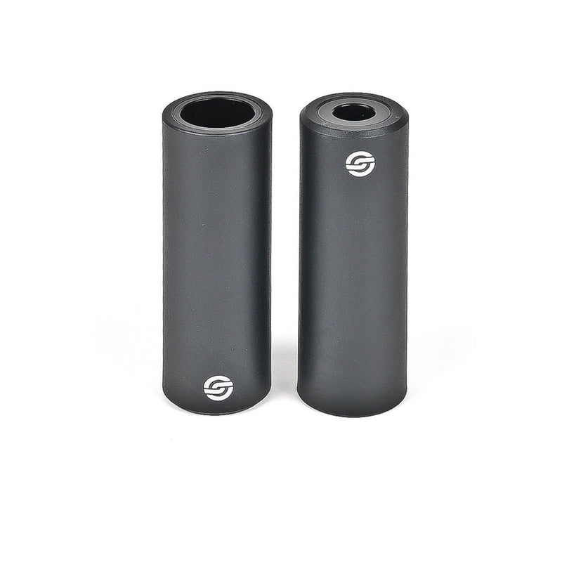 Pair of black SALT AM nylon pegs with steel core for street and skatepark riding, 4.5 inches long