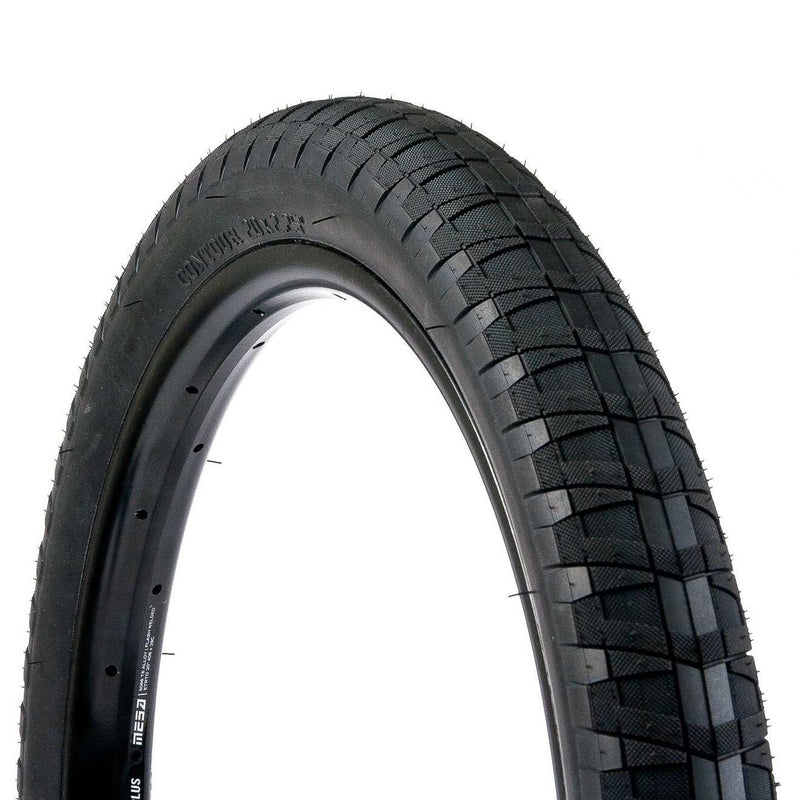 Black SALT CONTOUR TIRE with wrap around directional tread and micro-knurling for extra grip, available in 18"x2.35" and 20"x2.35" sizes.