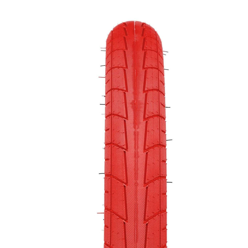 Red Salt Tracer Tire with modern directional tread and knurled surface for BMX bikes