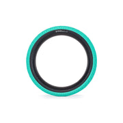 Salt Tracer Tire BMX replacement tire in black and teal with modern directional tread and knurled surface for improved traction.