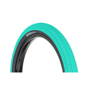 Salt Tracer Tire in teal color with directional tread and knurled surface for BMX bicycles.