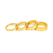 SALT HEADSET SPACER in gold, set of four alloy and carbon fiber spacers for bike stem adjustment.