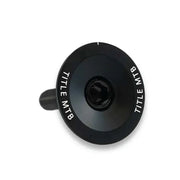 Black CNC-machined 6061 T6 alloy MTB headset top cap and bolt set with TITLE MTB branding