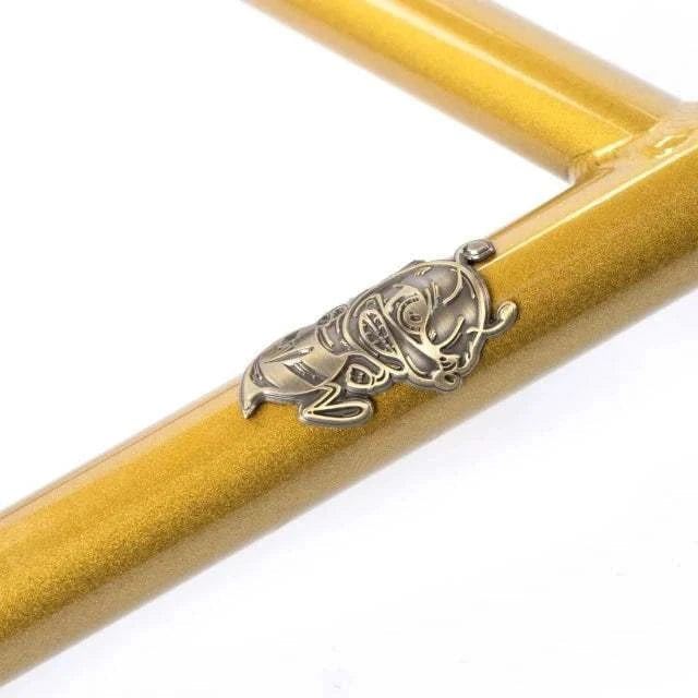 Close-up of gold TOTAL BMX Killabee K3 2PC handlebar with metal bee emblem, Kyle Baldock signature model made from heat-treated Chromoly steel