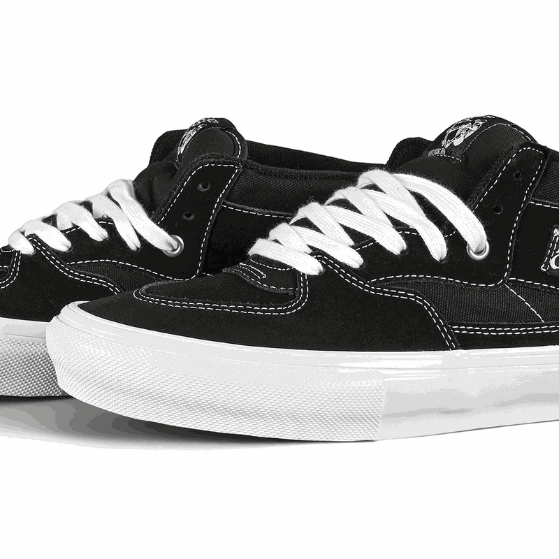 Black VANS SKATE HALF CAP sneakers with white laces and durable suede and canvas upper designed for skateboarding and BMX performance