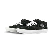 Black and white VANS SKATE HALF CAP shoes with suede and canvas upper, white laces, and durable rubber sole designed for skateboarding and BMX.