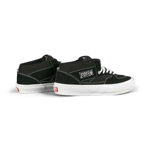 Black VANS Skate Half Cap shoes with white laces and soles, featuring suede and canvas construction and Steve Caballero signature design
