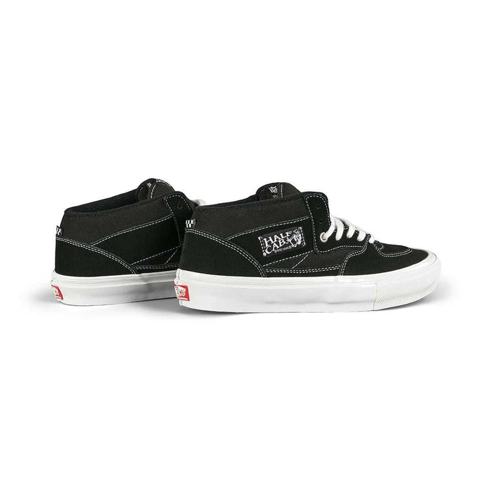 Black VANS Skate Half Cap shoes with white laces and soles, featuring suede and canvas construction and Steve Caballero signature design