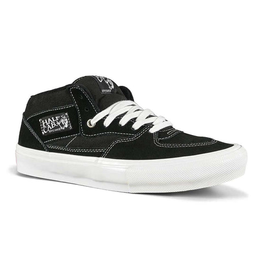 Black Vans Skate Half Cap sneaker with white laces and durable suede and canvas construction designed for skateboarding and BMX.