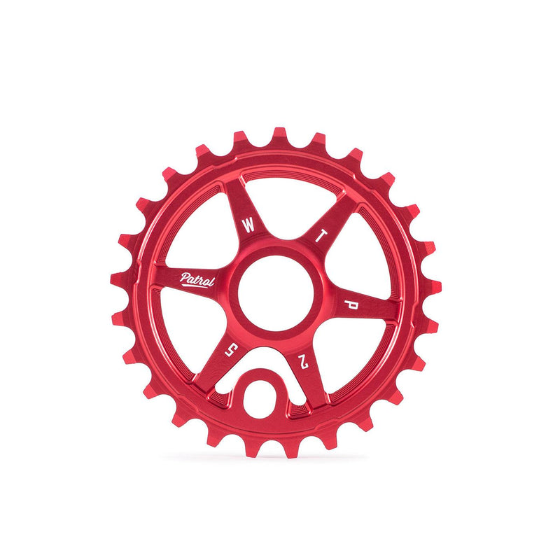 Red WETHEPEOPLE PATROL SPROCKET made from 6061-T6 alloy with CNC construction and offset teeth for BMX bikes.