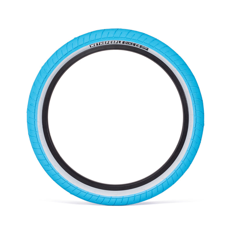 Blue WETHEPEOPLE ACTIVATE TIRE with fast-rolling tread and unique sidewall design.