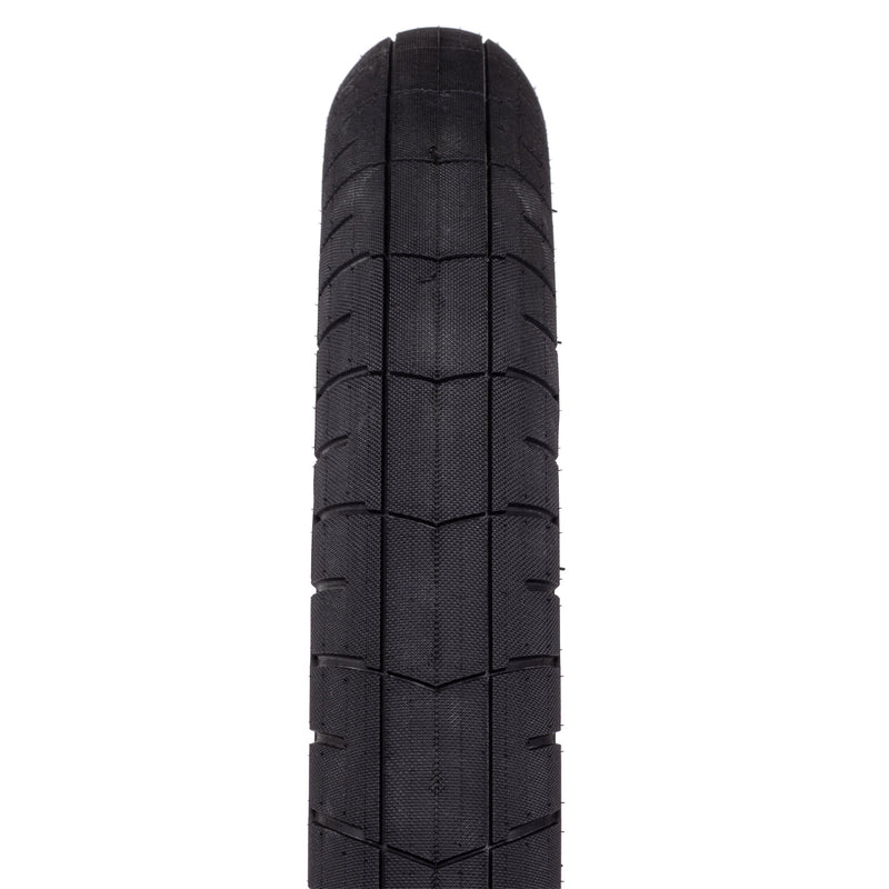 WETHEPEOPLE ACTIVATE TIRE, black tread design, knurled pattern, durable rubber, fast-rolling.