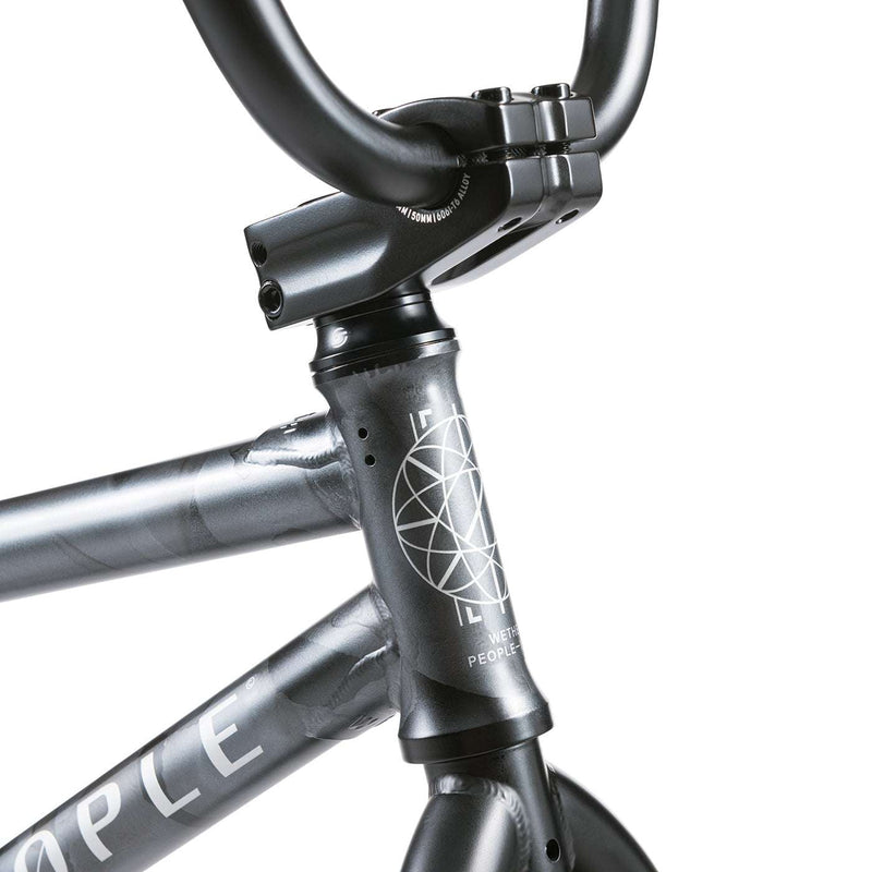 Close-up view of the black WETHEPEOPLE JUSTICE BIKE frame and handlebar stem with logo detail
