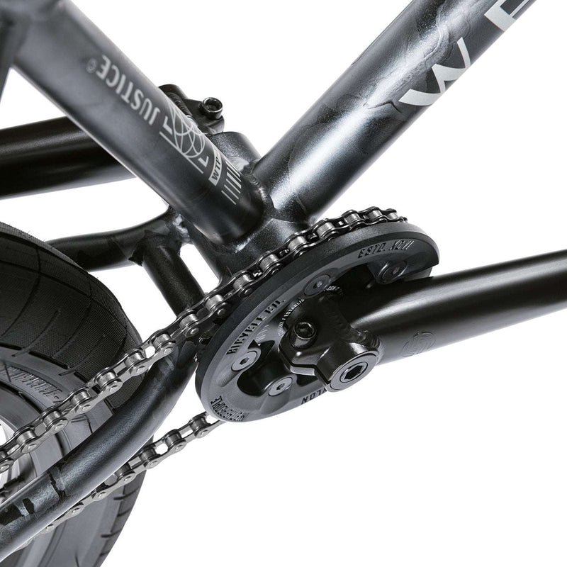 Close-up of the Wethepeople Justice Bike drivetrain and chainring showing black frame and components