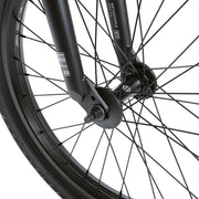 Close-up of front wheel and fork of WETHEPEOPLE JUSTICE BIKE showing black 22mm offset fork and salt pro hub with spokes