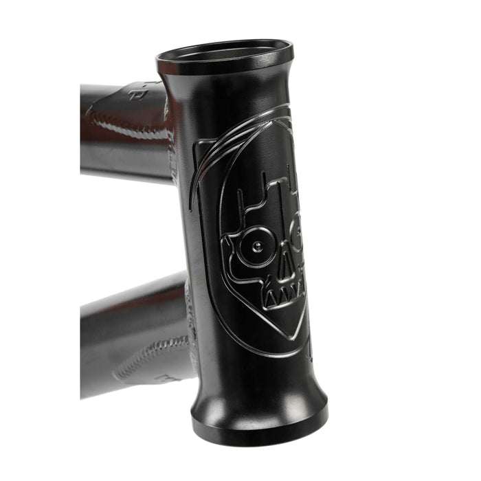 Close-up of black Wethepeople Pathfinder BMX frame head tube with engraved skull logo detailing