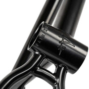 Close-up of black WETHEPEOPLE PATHFINDER BMX frame with engraved logo and strong welds
