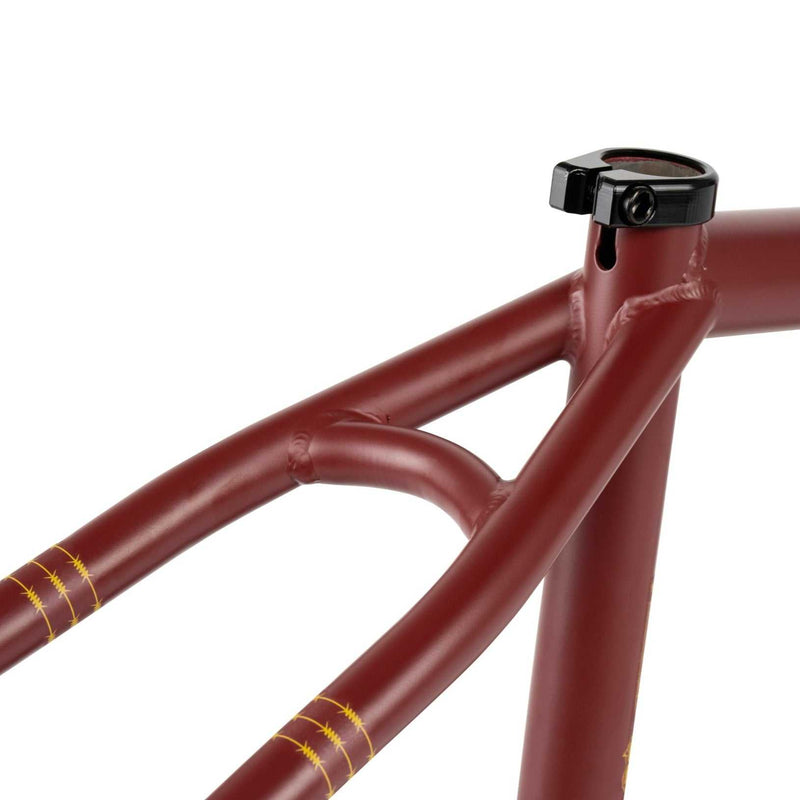 Wethepeople Pathfinder BMX frame in matt burgundy with CNC detailing and reinforced chainstays designed for durability and performance