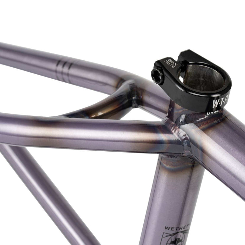 Close-up of WETHEPEOPLE PATHFINDER Frame in Trans Lilac showing CNC machined seat clamp and welded joints
