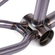 Close-up of WETHEPEOPLE PATHFINDER Frame bottom bracket and chainstay welds in raw metal finish