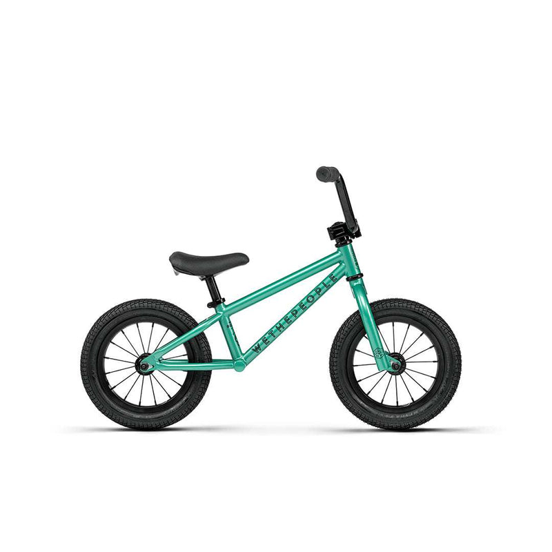 WETHEPEOPLE PRIME 12" balance bike in teal with knurled footpegs and professional BMX design for young riders