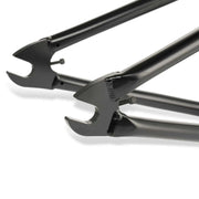 Close-up of black WETHEPEOPLE TRIGGER FRAME dropout and tubing made from butted Japanese seamless 4130 chromoly steel for BMX bike.
