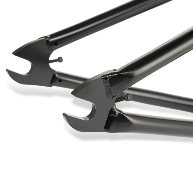 Close-up of black WETHEPEOPLE TRIGGER FRAME dropout and tubing made from butted Japanese seamless 4130 chromoly steel for BMX bike.