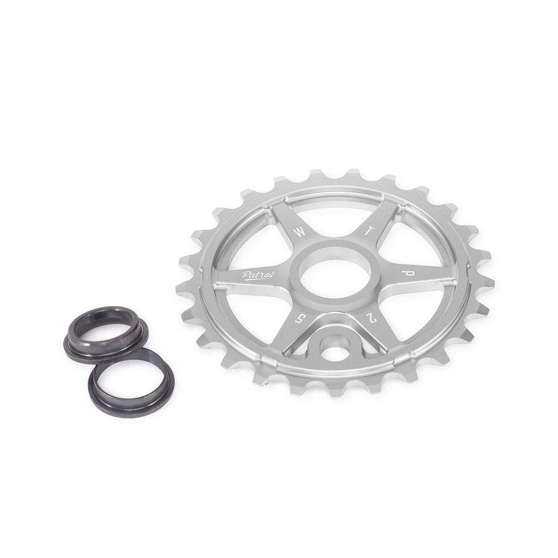 WETHEPEOPLE Patrol sprocket in silver alloy with three black adapters for BMX bikes.