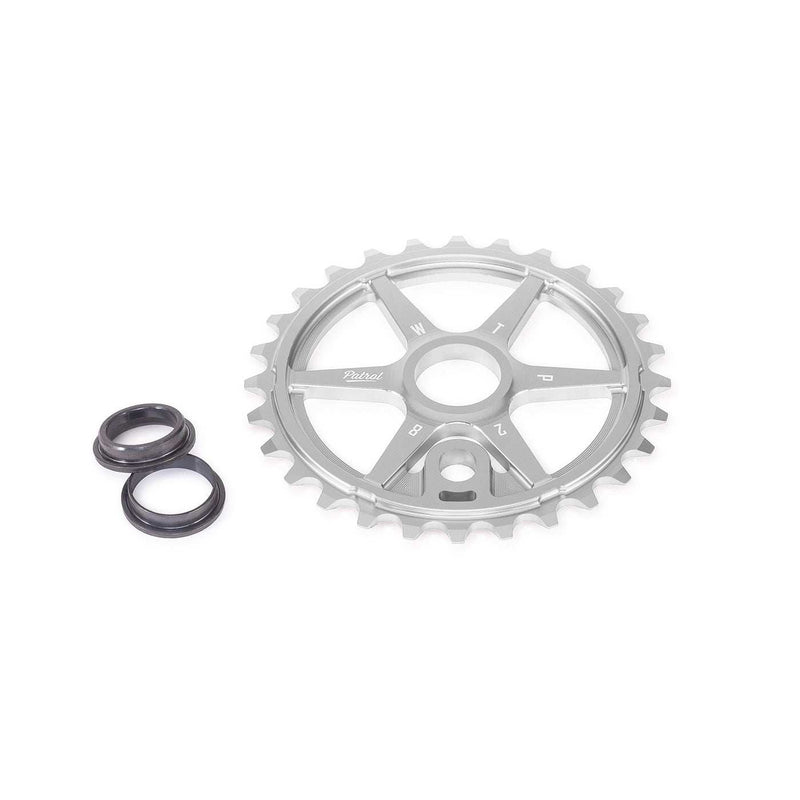 Silver WETHEPEOPLE PATROL SPROCKET with offset teeth and included adapters for BMX bike chain line adjustment