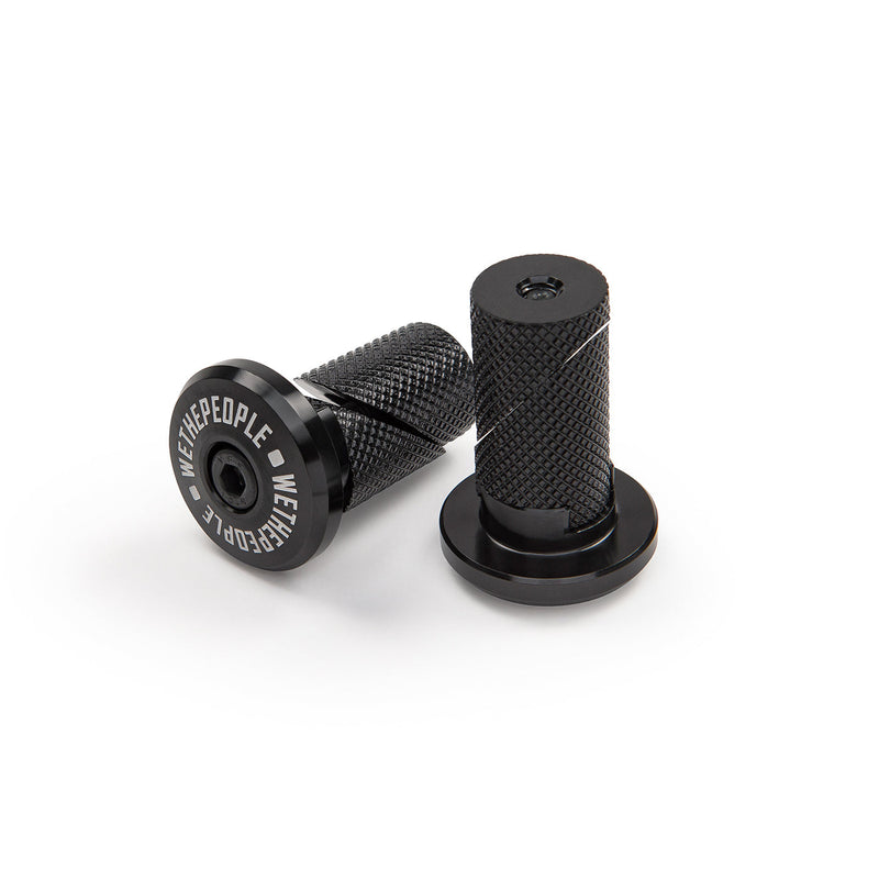 Pair of black WETHEPEOPLE SUPREME BAR ENDS made from CNC machined 6061-T6 alloy with knurled wedge design.