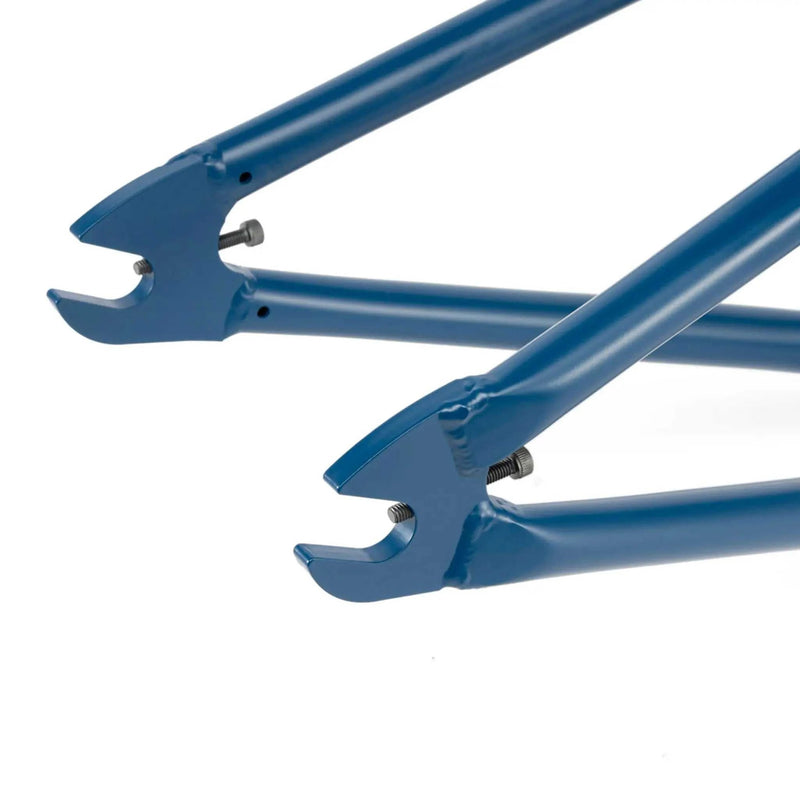 Close-up of the rear dropout section of a blue WETHEPEOPLE TRIGGER FRAME BMX bike frame made from durable Japanese 4130 chromoly steel tubing