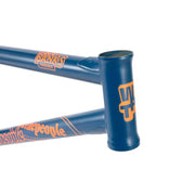 Wethepeople Trigger Frame BMX bike frame in matte navy with orange branding, durable crmo tubing and adaptive geometry.
