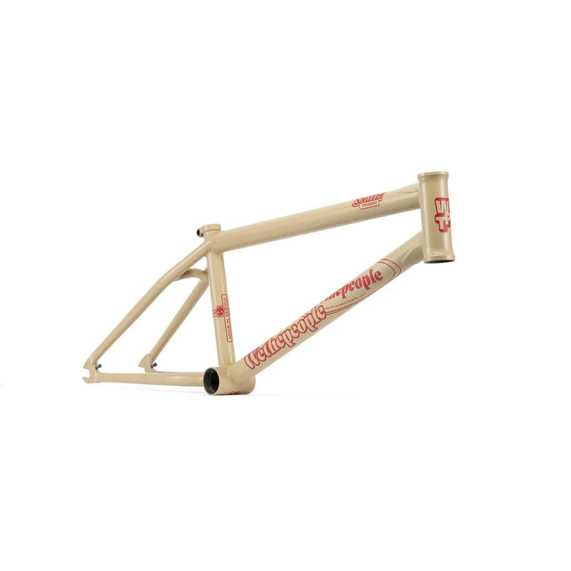 WETHEPEOPLE TRIGGER FRAME beige BMX bike frame with red logo and adaptive geometry design