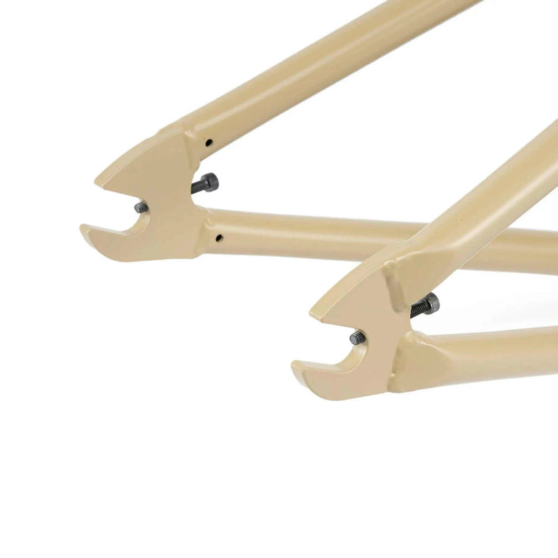 Close-up of beige Wethepeople Trigger Frame rear dropouts and chainstay sections designed for BMX bikes