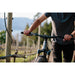 Black MTB AH1 aluminum handlebar installed on mountain bike with rider holding grips outdoors