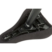 Close-up of black Odyssey Seat Post attached to tripod bike seat showing CNC machined 6061-T6 aluminum construction and mounting bolt.