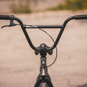 Close-up of Sunday Scout 20" BMX bike handlebars and front brake lever in matte black finish.