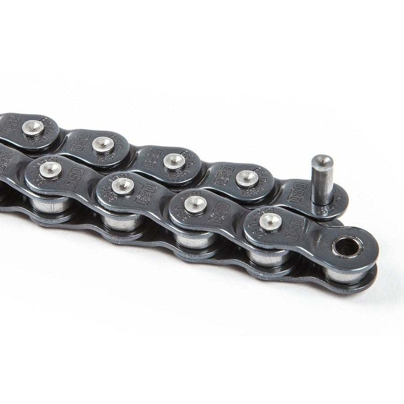 Close-up of BSD 1991 HALFLINK CHAIN with rustproof Teflon coating and stamped BSD logos, compatible with 8t drivers.