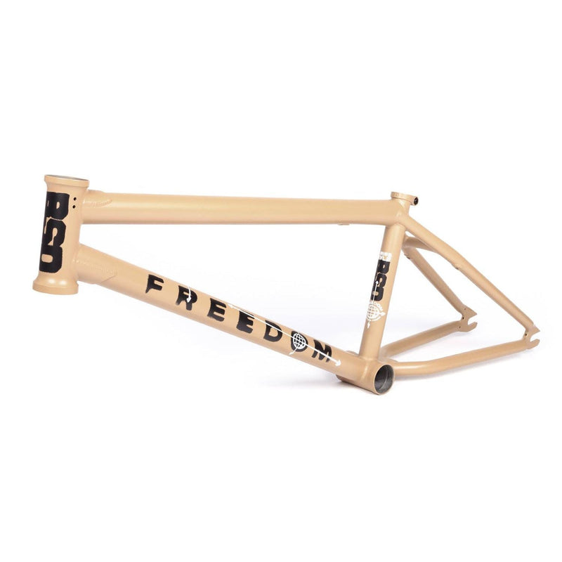 BSD Freedom Frame BMX bike frame in beige with bold black lettering, designed for stability and versatility on various terrains.
