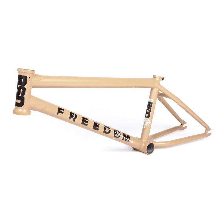 BSD Freedom Frame BMX bike frame in beige with bold black lettering, designed for stability and versatility on various terrains.